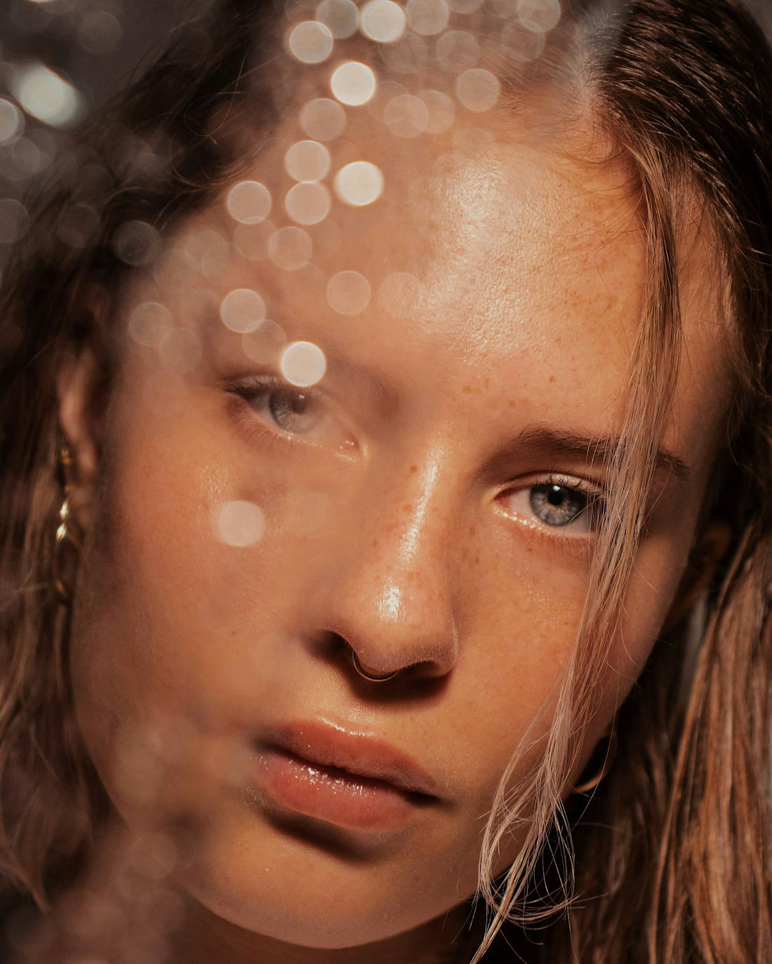 Close-up portrait of a woman with clear, even-toned skin